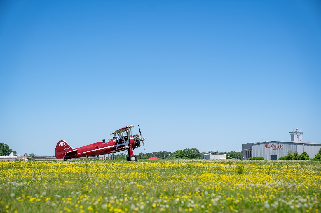 A biplane taxis.