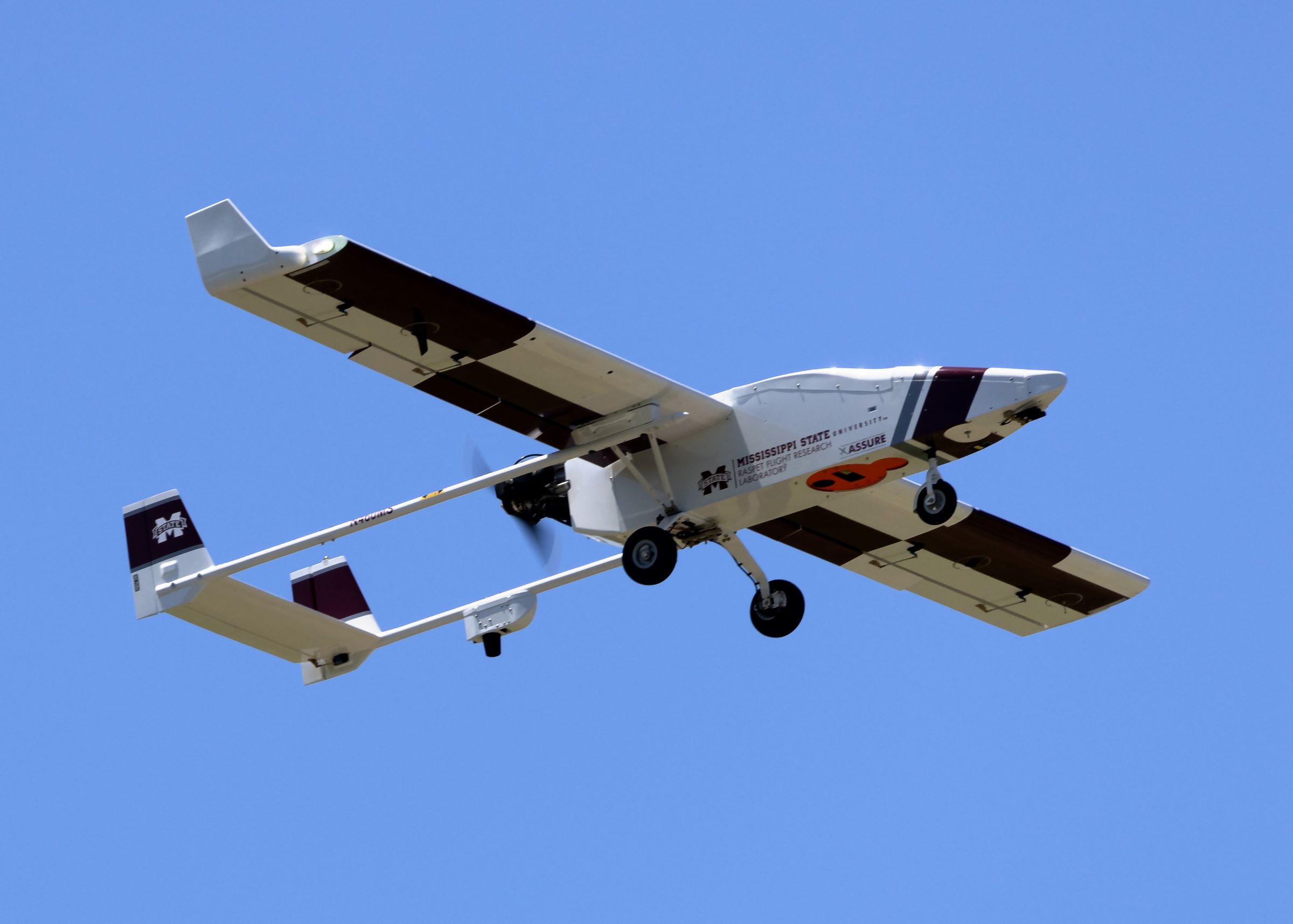 A TigerShark UAS flies through the sky. 