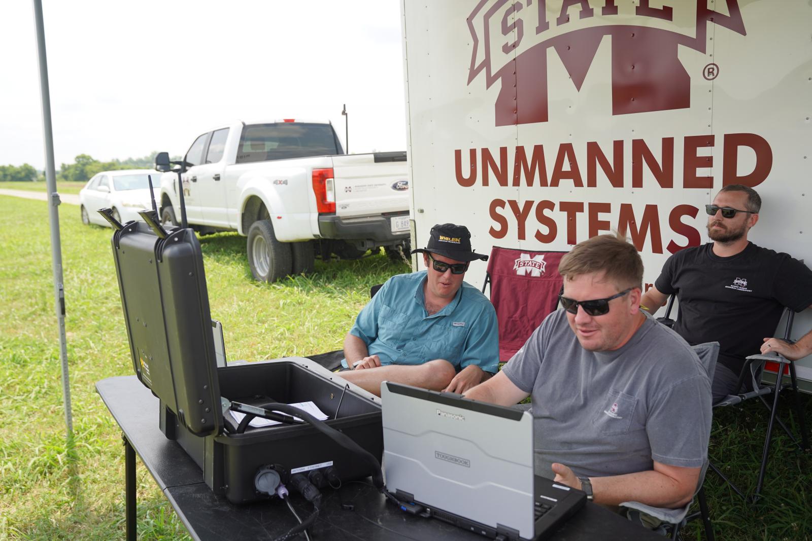 Mississippi State Raspet flight technicians and Aurora engineers monitor flight operations from the ground control station during a SKIRON-X training flight.