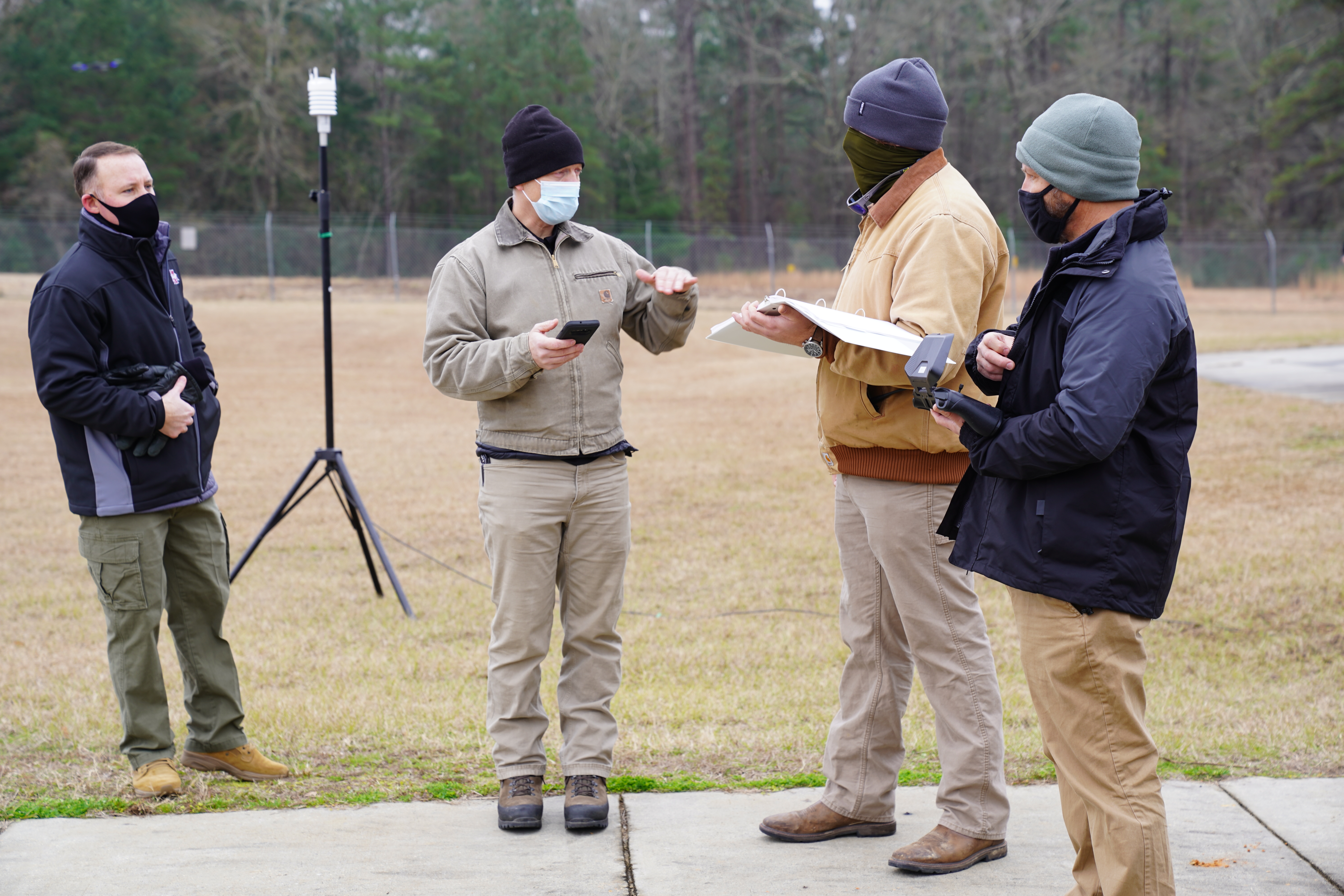 Raspet personnel work with a vendor representative prior to a UAS exercise. 