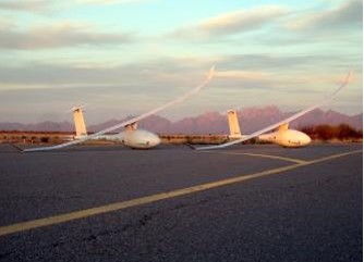 Planes on runway at sunset