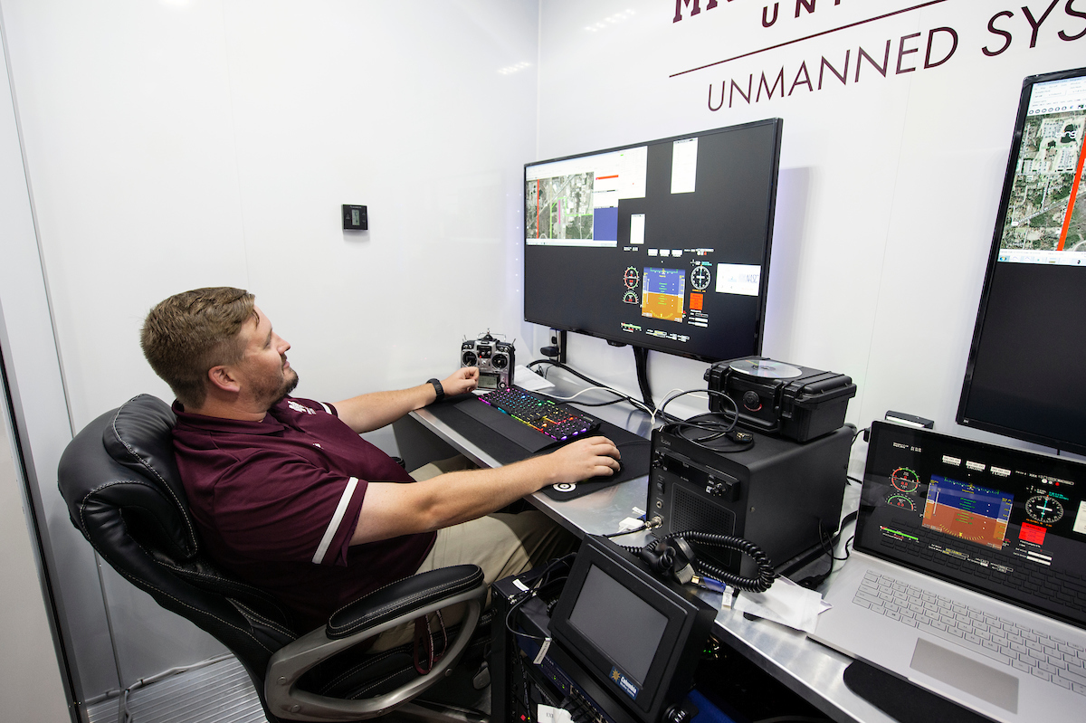 A pilot sits in the command center